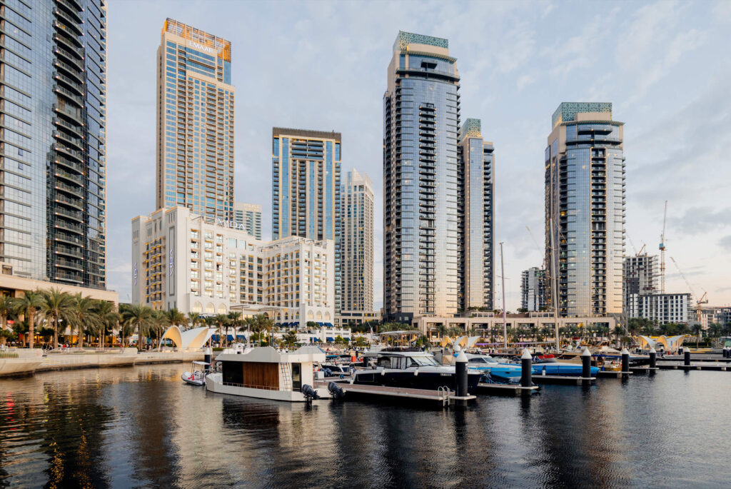 Dubai Creek Harbour marina with EMAAR waterfront residential towers and yachts at Harbour Promenade, Dubai, UAE