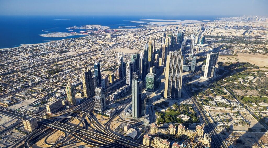 Dubai Industrial Property Opportunities You Can't Afford to Miss 1 Dubai Industrial Opportunities - Aerial view of Downtown Dubai skyline with Sheikh Zayed Road interchange, Dubai, UAE