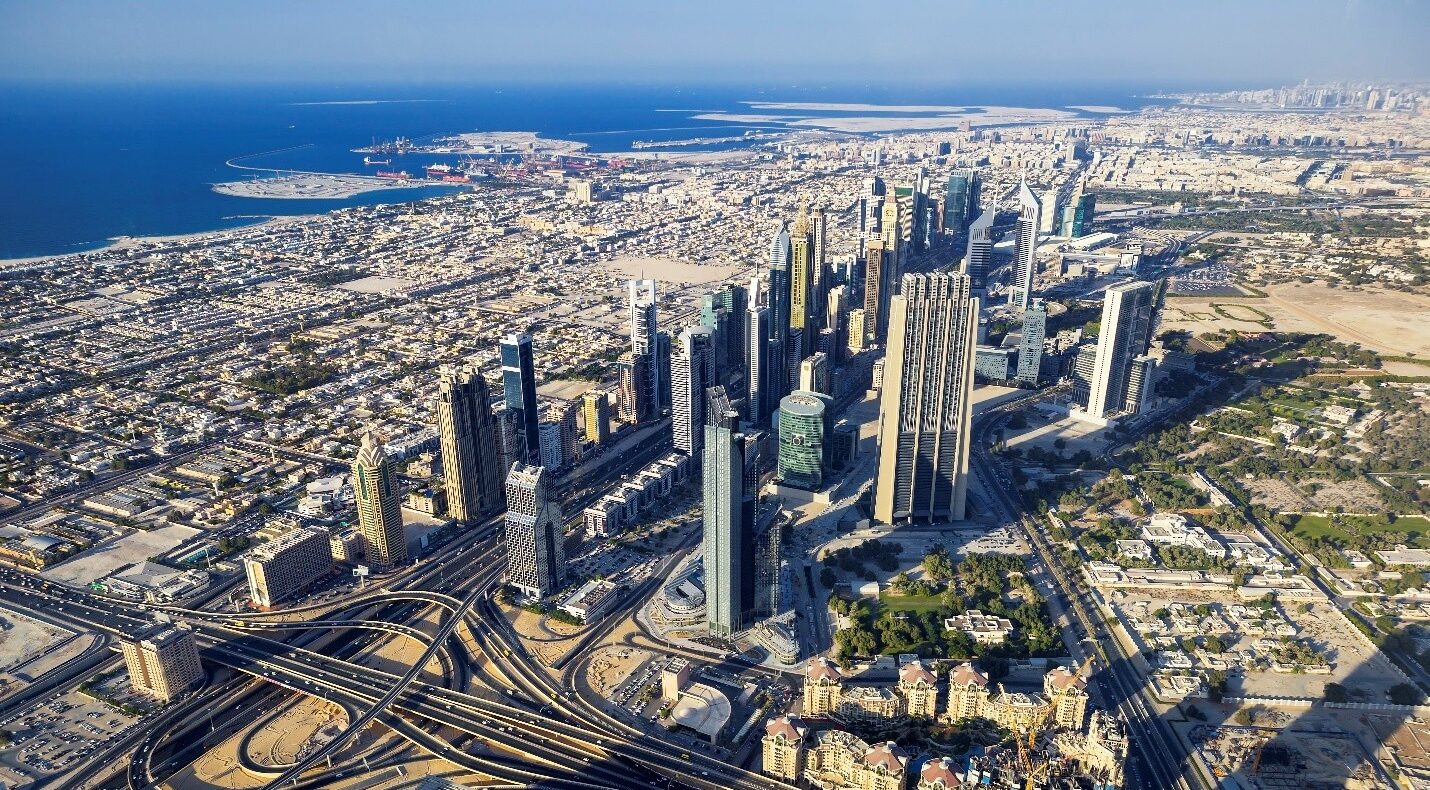 Dubai Industrial Opportunities - Aerial view of Downtown Dubai skyline with Sheikh Zayed Road interchange, Dubai, UAE