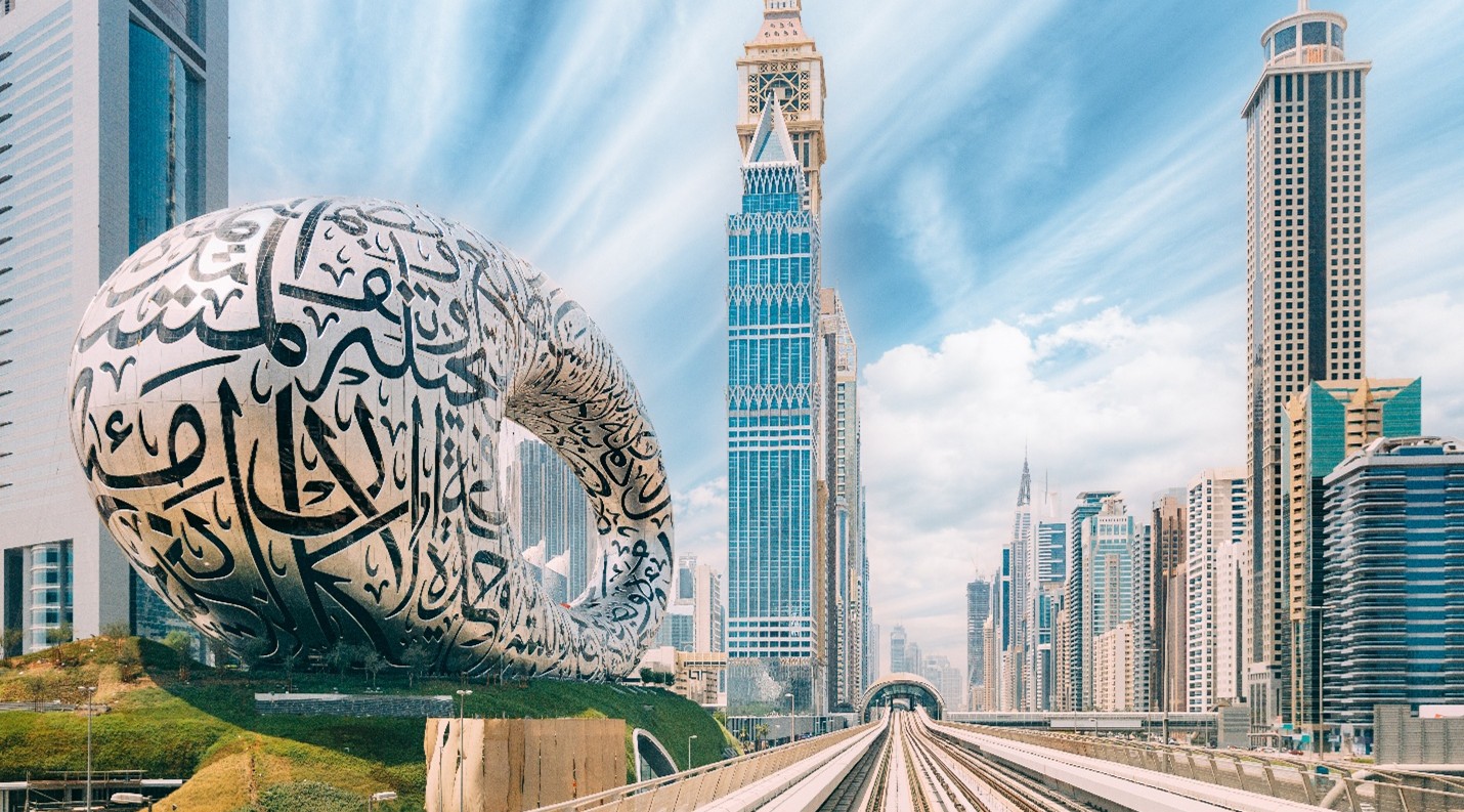 Dubai Real Estate Trends in 2025 - Museum of the Future building next to Dubai Metro tracks and Sheikh Zayed Road skyline in Dubai