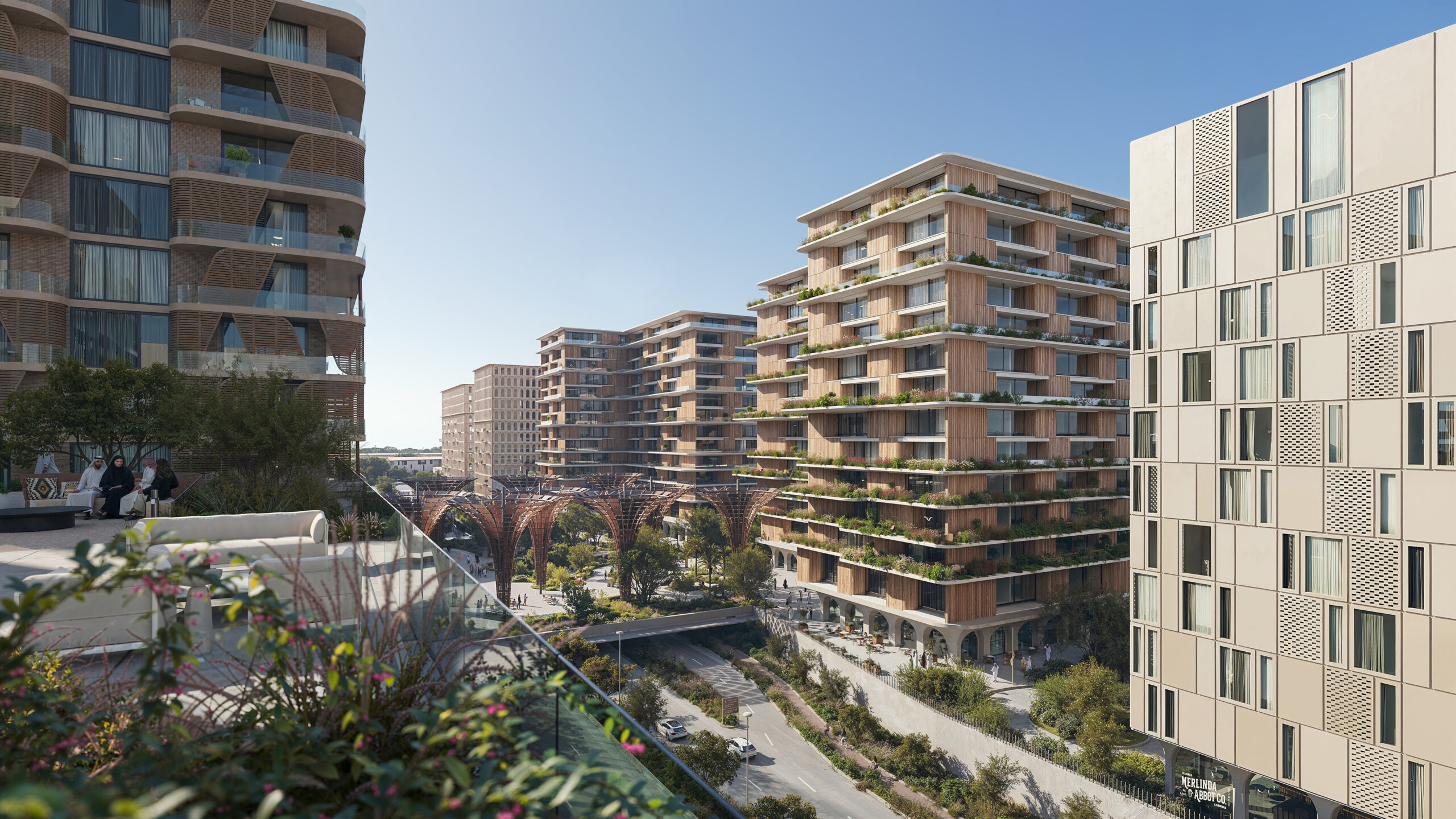 Modern residential buildings in Expo Downtown, Expo City Dubai, with landscaped terraces and pedestrian walkways.