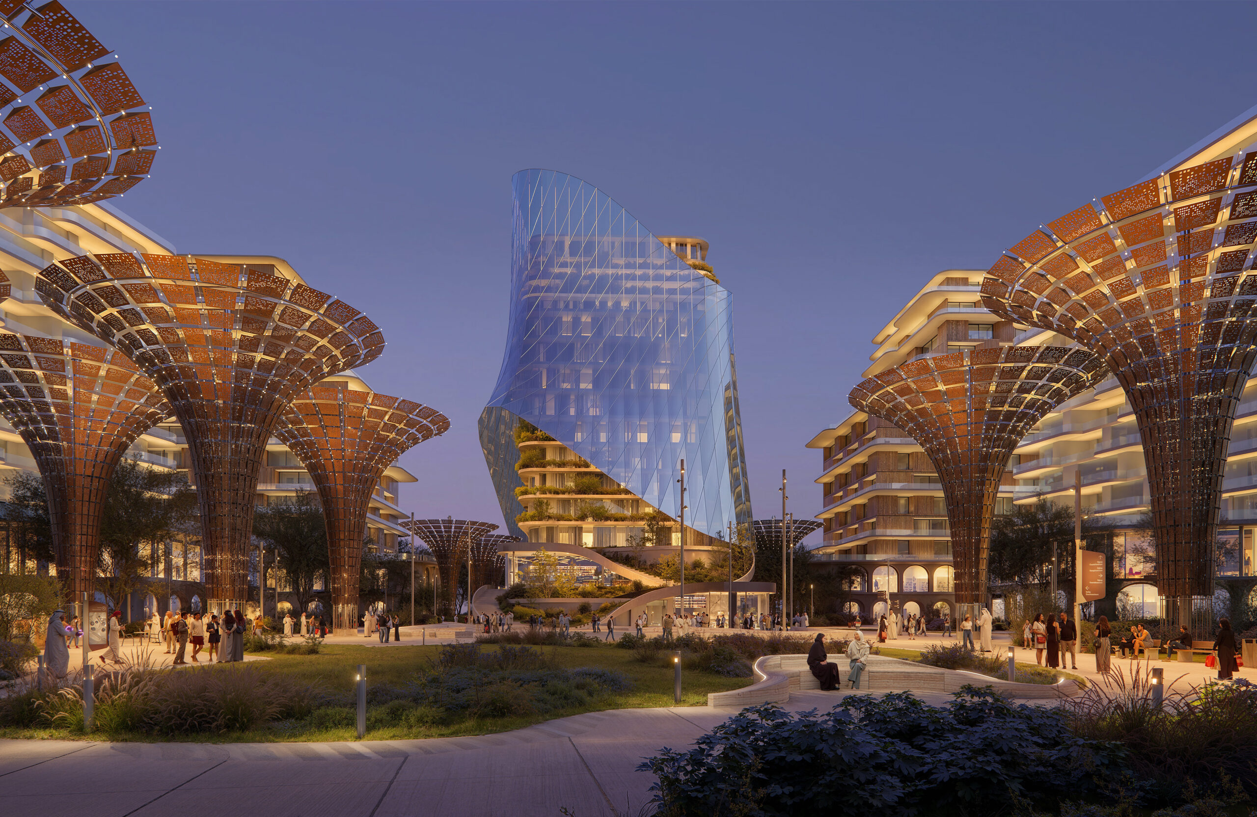 Evening view of Terra Tower in Expo City Dubai with illuminated canopy structures and landscaped surroundings.