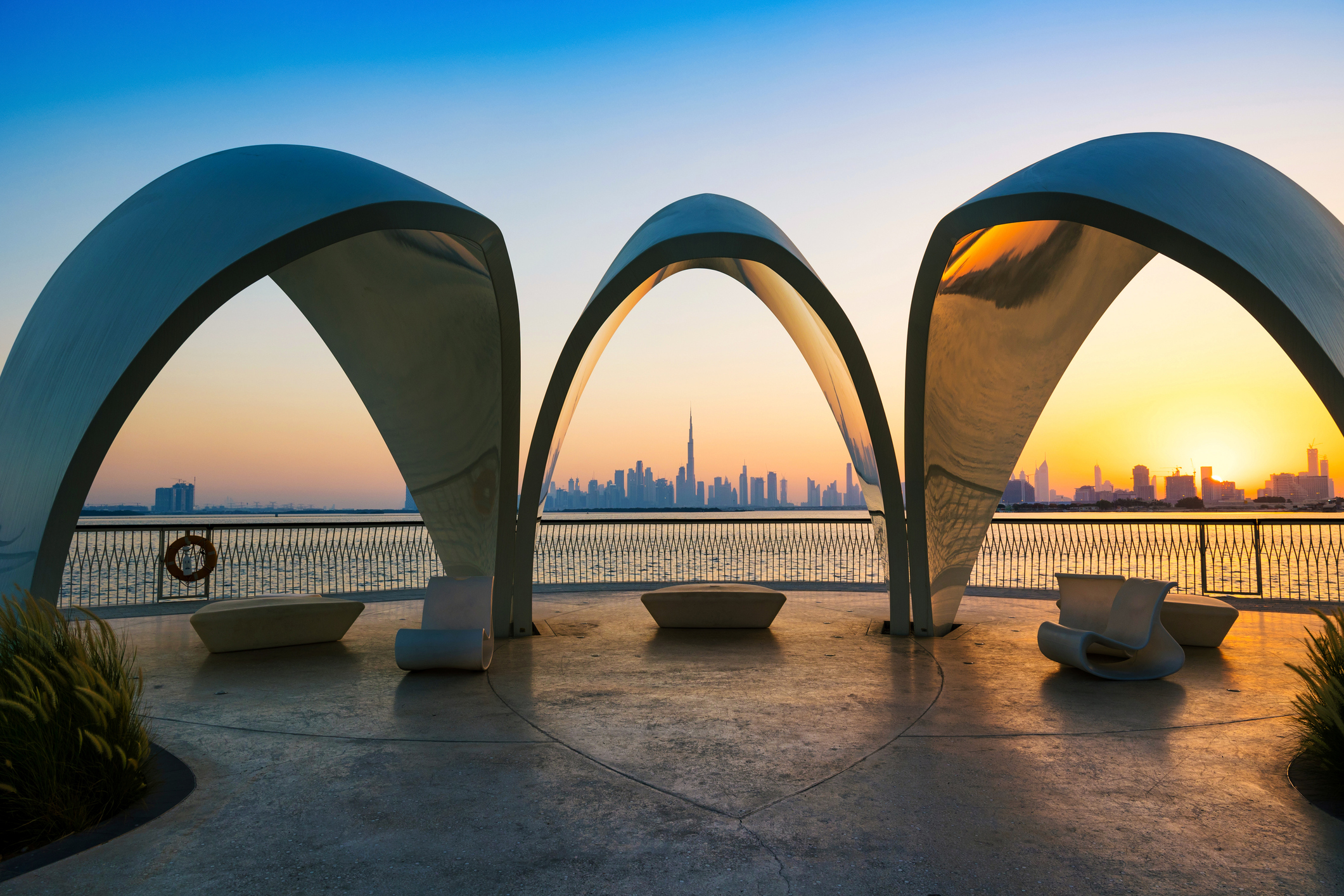 Dubai Off-Plan Investments in 2025 features Dubai Creek Harbour with Burj Khalifa framed by modern waterfront arches.